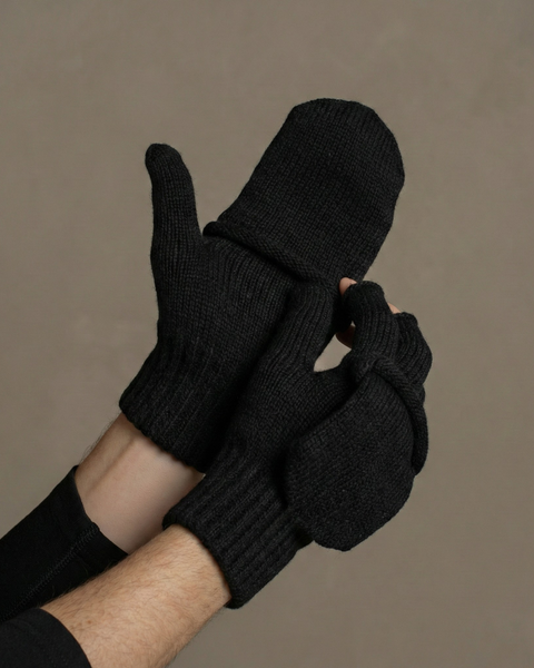 Close-up of black merino wool convertible gloves with flip-top mitten covering fingers for added insulation.