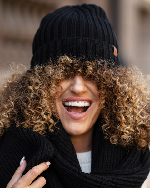 Women's Ribbed Beanie Knitted Merino in black color.