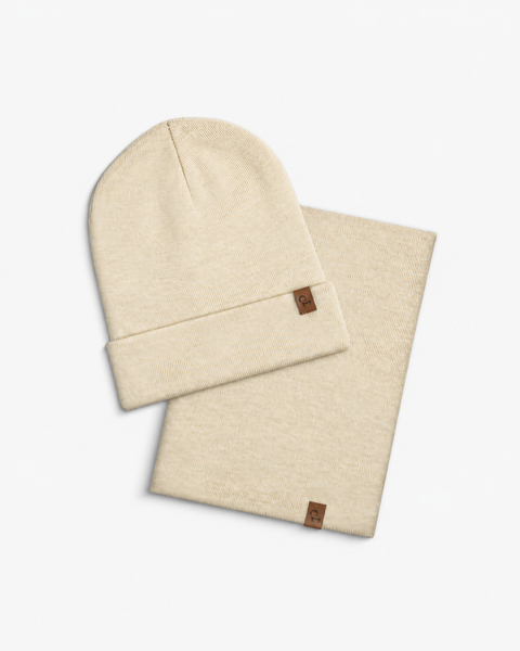 Flat lay set showing a folded natural beanie and a matching natural neck gaiter.