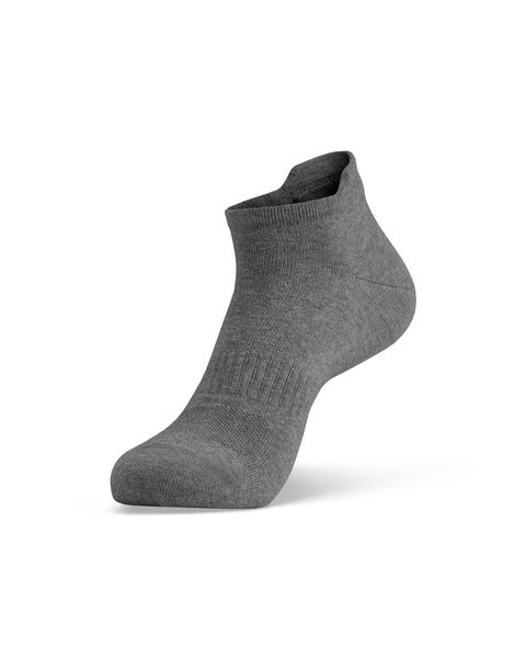 A single gray ankle sock shown on a foot model, angled to display the side profile and the top opening.