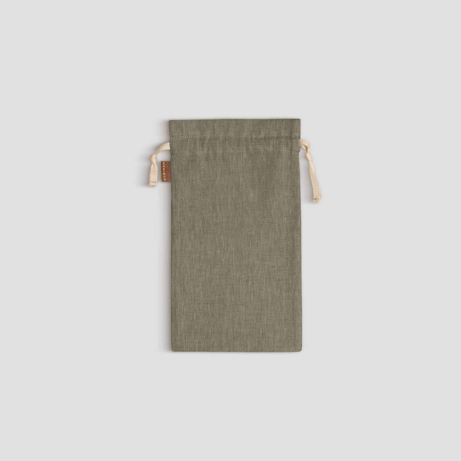 Stone Green drawstring bag on a light gray background