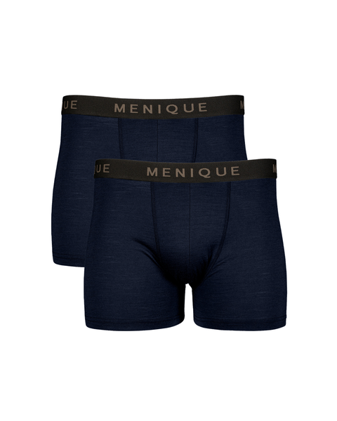 A flat-lay product shot of two identical pairs of men's short boxer briefs in a dark navy blue color. They are arranged in a staggered vertical stack. Each pair features a contrasting black elastic waistband with "MENIQUE" woven in light brown text. The background is pure white.