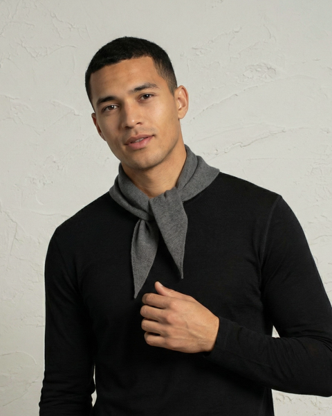 Man wearing a gray cashmere merino knit bandana scarf in a minimalist style