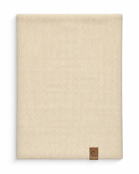 Flat lay of a natural tubular neck gaiter with a small brown logo tag on the bottom right.