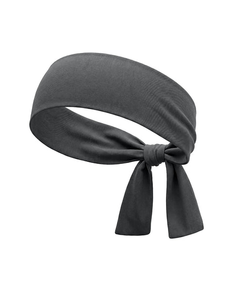 A product shot of a grey tie headband shown tied in a knot with the ends hanging down. It is displayed against a pure white background.