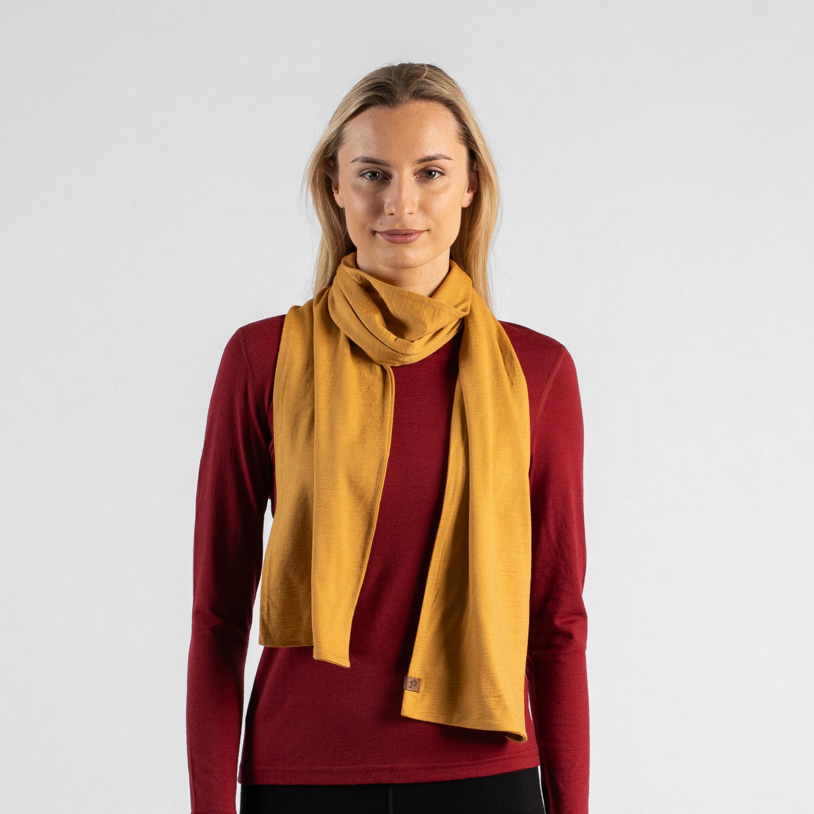 Woman wearing yellow merino wool scarf soft lightweight breathable wrap for all seasons